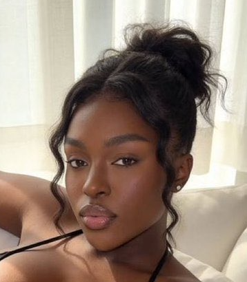 Horny Ebony Babe Serves Major Cleavage in Black Bikini