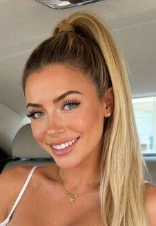 Blonde Bombshell Flaunts Huge Tits in Luxury Car