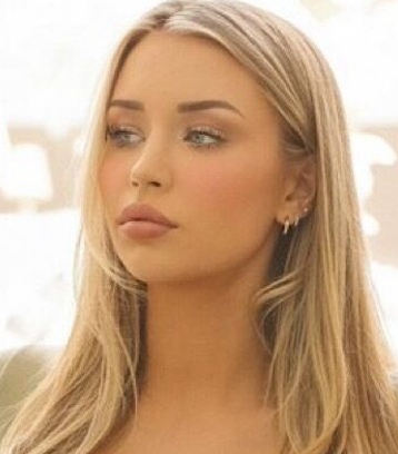 Blonde Bombshell Teases in Tight Crop Top and Denim Shorts